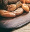 Bread loaves variety on wood. Traditional bakery concept