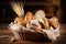 Bread and lots of fresh bread buns in a basket on a wooden table