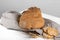 The bread of Matera, Pane di Matera on linen napkin on white wooden background, typical southen italian sourdough bread