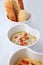 Bread onion sauce in bowl, close up white background