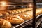 Bread in the oven at a bakery. Production and baking of fresh bread. Industrial furnace. Baking bread. Fire, smoke and steam.