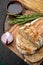 Bread, pepper, garlic, oil on a wooden table