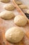 Bread Rolls Rising on Rustic Wooden Table