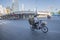 Bread seller rides in front of Ben Thanh tourist market as it is closed for the shutdown of Ho Chi Minh City