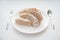 Bread served on white table with fork and spoon