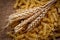 Bread spikes and pasta on rough fabric background