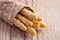 Bread sticks grissini with sesame seeds in craft pack