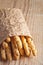 Bread sticks grissini with sesame seeds in craft pack