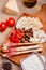 Bread sticks with prosciutto Cured Meat on a wooden board