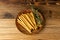 Bread Sticks on Wood Plate, Salted Breadstick, Crispy Grissini, Dry Homemade Pretzel on Wooden Background