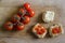 Bread with tomatoes on chopping board. Frise, friselle.