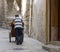 Bread Vendor Pushing His Cart in an alleyway of the Christian Quarter, Jerusalem, Israel
