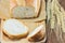 The bread and wheat on the wood background, selective focus