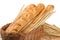 Bread in a wicker basket, French baguette, composition with wheat spikelets