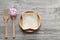 Bread in the wooden bowl with spoon and fork and measure tape on wooden background, Healthy Eating and Diet concept