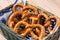 Breadbasket with traditional Bavarian pretzels with German flag