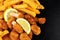 Breadcrumb Covered Fried Scampi And Chips On Slate Background