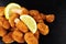 Breadcrumb Covered Fried Scampi On Slate Background