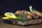 Breaded Chicken Meat With Salad And Lemon Resting On a Rustic Wooden Board