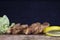 Breaded Chicken Meat With Salad And Lemon Resting On a Rustic Wooden Board