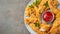 Breaded chicken strips with tomato ketchup on a white plate. Fast food on dark brown background. Top view with copy space