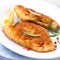 Breaded fish fillet with rosemary and lemon