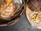 breads in baskets, variety baking products on wooden surface