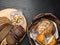 breads in baskets, variety baking products on wooden surface