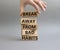 Break away from bad habits symbol. Wooden blocks with words Break away from bad habits. Beautiful grey background. Businessman