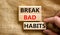 Break bad habits symbol. Concept words Build good habits on wooden blocks on beautiful canvas background. Businessman hand. Copy