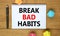 Break bad habits symbol. Words `Break bad habits` on beautiful wooden table, colored paper, black metallic pen. Business,