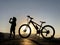 The break moment of a thirsty child riding a bicycle in hot weather