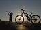 The break moment of a thirsty child riding a bicycle in hot weather