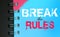 Break the rules text message words on sky blue page of copybook in white and pink. Lifestyle concept