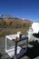 Break time snack with two hot chocolates on a cosy patio in the middle of beautiful Southern Alps and blue sky New Zealand