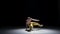 Breakdance dancer man in cap with naked torso dance, black, shadow
