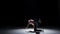 Breakdance dancer man with naked torso dance, on black, shadow