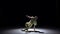 Breakdance dancer in yellow suit continue dance on black, shadow, slow motion