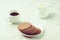 Breakfas espresso white cup with cookies and milk Breakfast espresso white cup with cookies and milk on white table.