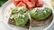 Breakfast avocado toast with soft white cheese