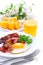 Breakfast with bacon, fried egg and orange juice