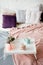 Breakfast in bed. Bedroom in pastel colors