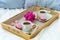 Breakfast in bed for two. Wooden tray with coffee, macaroons and Bizet.