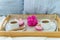 Breakfast in bed for two. Wooden tray with coffee, macaroons and Bizet.