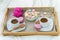 Breakfast in bed for two. Wooden tray with coffee, macaroons and Bizet. D
