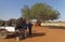 Breakfast being prepared for a Female Tourist on the tailgate of a Toyota Landcruiser Safari Vehicle