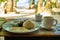 Breakfast on Boracay island of the Philippines with views of the white sandy beach and sea. An omelet and a Cup of coffee in a