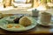 Breakfast on Boracay island of the Philippines with views of the white sandy beach and sea. An omelet and a Cup of coffee in a