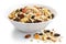 Breakfast bowl of fruit and nut muesli on white.