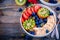 Breakfast bowl: granola with banana, kiwi, strawberry, blueberries and chia seeds